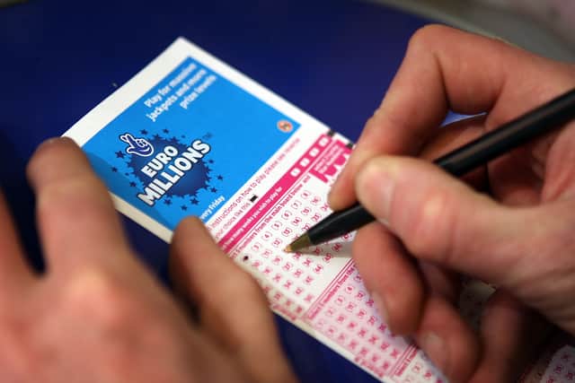 A punter fills out a EuroMillions ticket in London.  (Photo by Peter Macdiarmid/Getty Images)