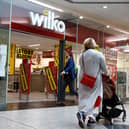  Shoppers walk past a Wilko store in Putney on September 12.