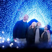 A group of friends enjoy the iconic Christmas Cathedral at Christmas at the Botanics.
