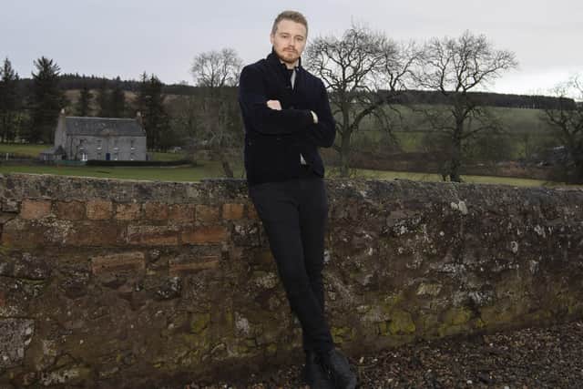 Oxton actor Jack Lowden visit his home village to buy shares in the community shop.