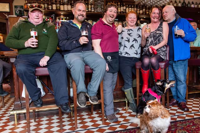 Nikki Cassidy, fourth from left, with regulars at the Bridge Inn in Peebles.