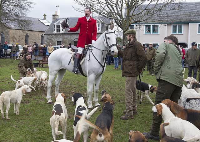 Master of foxhounds Lee Peters addresses the hunt and its supporters on Denholm green.