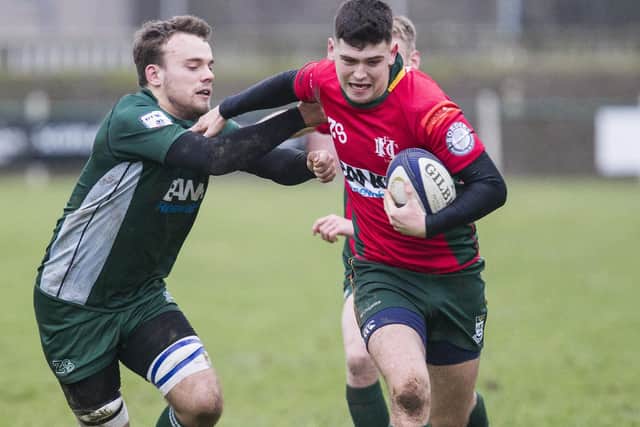 Jamie Grant tries to get to grips with Hawick East's Bailey Donaldson, in red (picture by Bill McBurnie)