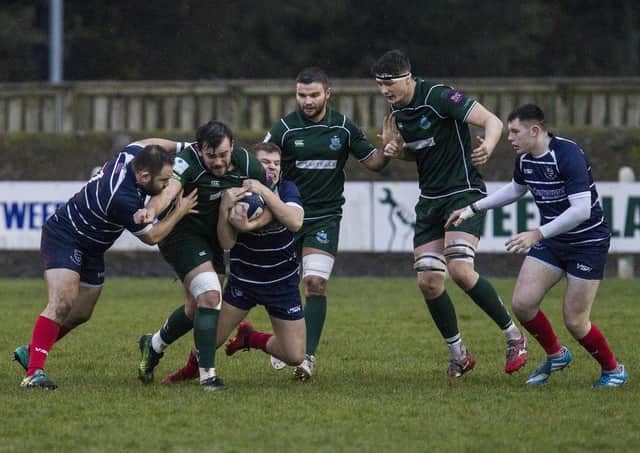 Hawick's loose head prop Shaun Muir receives some attention from Musselburgh at Mansfield Park (picture by Bill McBurnie)