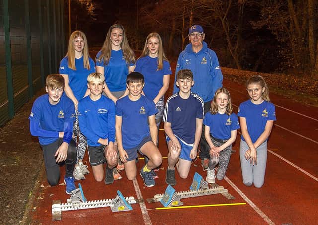 Jed Athletics members with coach Chico Woods at the running track at Jedburgh sports centre.