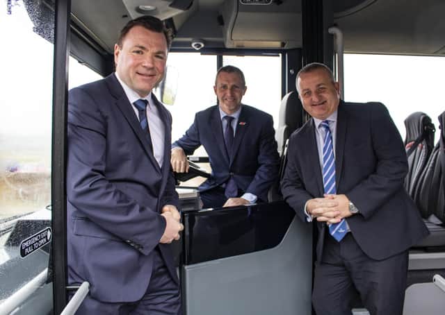 From left, West Coast Motors boss Colin Craig, government minister Michael Matheson and Alexander Dennis regional sales manager Charlie Miller aboard one of Borders Buses’ new vehicles.