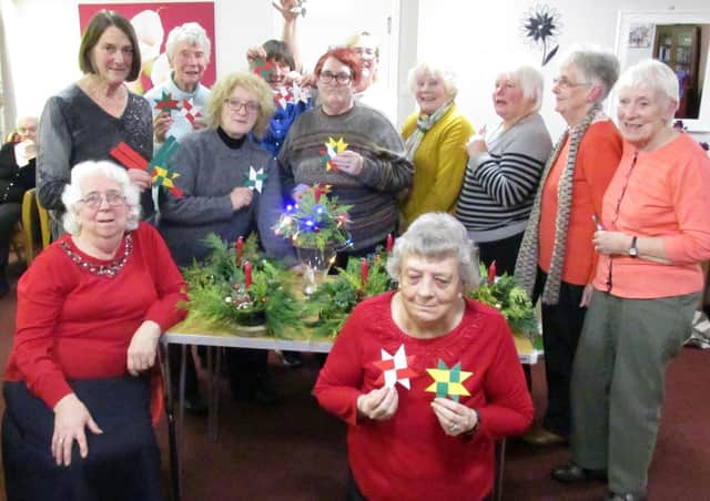 Christmas Crafts was the theme of the recent meeting of Earlston SWI when members had the opportunity to try their hands at making a festive table decoration and a folded paper Danish star, with Betty Turnbull and Gill Cooper leading the enjoyable sessions. Competition winners were as follows. Small giftwrapped box: 1st Gill Cooper, 2nd Edith Cockburn. Decorative candle: 1st Edith Cockburh, 2nd Wilma Moffat. The next gathering is for the Christmas lunch at the Firebrick, Lauder, at 12pm for 12.30pm, with the competition a special piece of Christmas jewellery.Members of Earlston SWI on their craft night.