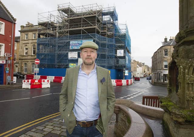 Rob Armstrong outside the scaffolding-clad building in Jedburgh.