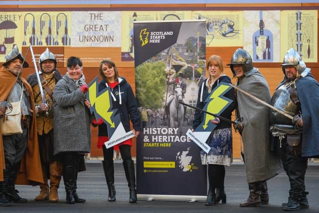 Hawick historical re-enactment group the Steel Bonnets with, from left, Network Rail's Juliet Donnachie and the Midlothian and Borders Tourism Action Group's Jemma Reid and Vanessa Wegstein launching the campaign at Edinburgh Waverley railway station.