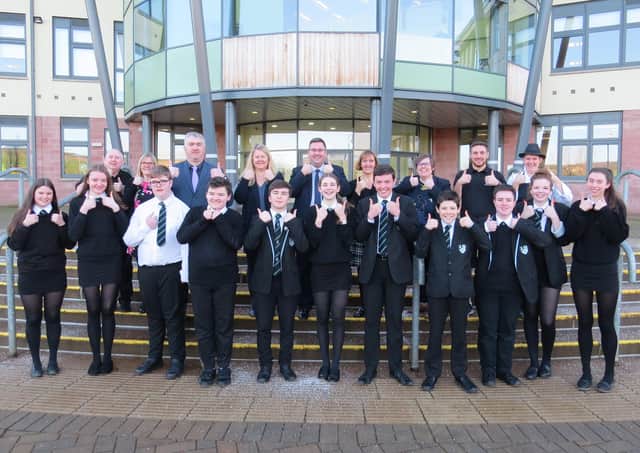 Staff and pupils at Earlston High School celebrating being given the thumbs-up by Education Scotland.