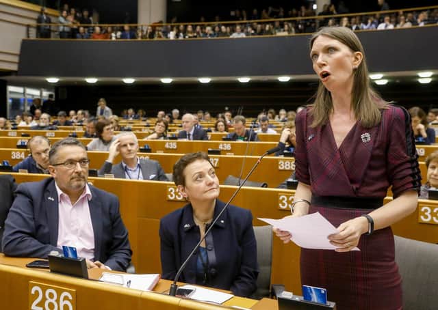 Heather Anderson, centre, listens to fellow SNP MEP Aileen McLeod give a speech at Brussels.