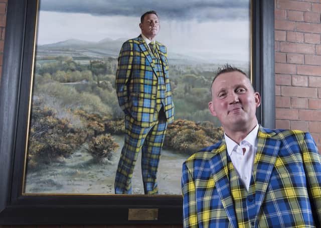 Doddie Weir with a portrait of himself now on show at the Scottish National Portrait Gallery in Edinburgh. Photo: Neil Hanna