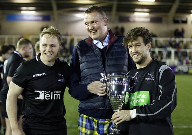 Doddie Weir presents the Club Trophy in his name to Newcastle Falcons players Alex Tait and, right, captain Dominic Waldouck (picture by Chris Lishman)
