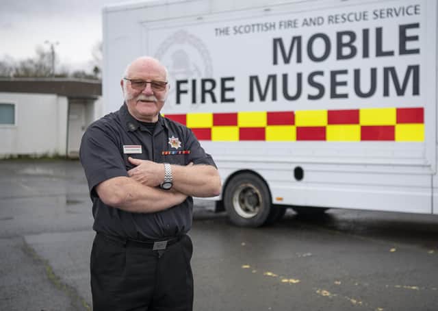 Dave Farries with the mobile museum he helped set up.