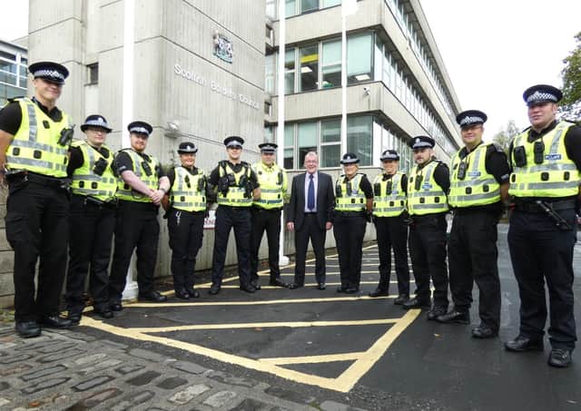 Hawick and Hermitage councillor George Turnbull with members of the Borders' first and second police community action teams.