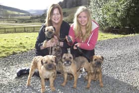 Kath and Cheyenne Lothian with their five Border Terriers that qualified for Crufts:  Ocean, Star, Lucky, Sandi and Duke.