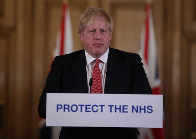 British prime minister Boris Johnson giving a press briefing at Downing Street in London on the spread of coronavirus through the UK on March 22. (Photo by Ian Vogler/WPA pool/Getty Images)