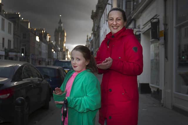 Asha and Kelly McArthy clap on the High Street in Hawick.