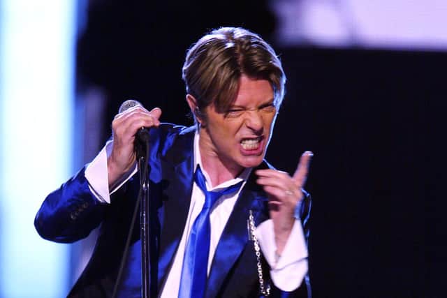 David Bowie performing at the 2002 VH1 Vogue Fashion Awards at Radio City Music Hall in New York City in 2002. Photo by Scott Gries/Getty Images.