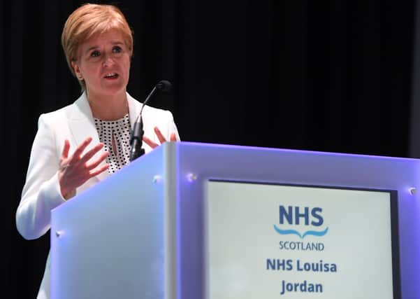 Scotland's first minister, Nicola Sturgeon, on Friday at the NHS Louisa Jordan field hospital set up at the Scottish Events Campus in Glasgow. (Photo by Andy Buchanan/WPA pool/Getty Images)