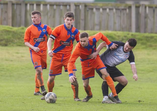 Hawick Royal Albert, in orange, in action this year against Ormiston (library image)