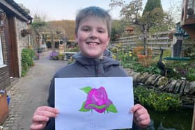 Zac Foggin, 6, from Earlston with his artwork.