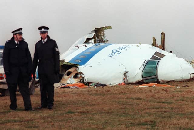 Police officers near the wreckage of the 747 Pan Am airliner that exploded and crashed at Lockerbie in December 1988. (Photo: Roy Letkey/AFP via Getty Images)