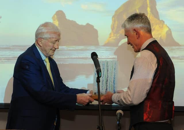 Scottish reugby legend Jim Telfer, left, makes a special presentation to Graham Marshall, right (picture by Grant Kinghorn)