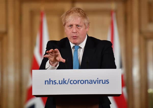 UK prime minister Boris Johnson announcing the lockdown today. (Photo by Leon Neal/Pool/AFP via Getty Images)