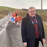 MP David Mundell is calling for a long-term solution to flooding on the A701 route.