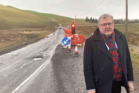 MP David Mundell is calling for a long-term solution to flooding on the A701 route.