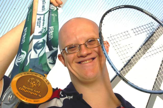 Craig Sharratt, pictured in 2007, proudly displays the badminton medals he won at the Special Olympics in China.