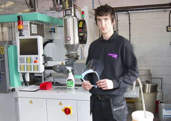 Rory Hancock, a supervisor at Cademuir Engineering at Selkirk, with one of the face masks it is making for medics and carers.