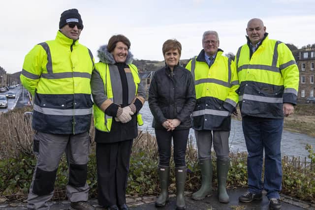 Hawick Volunteer Flood Group volunteers Andy Lewis, Marion Chrystie, Stuart Marshall and Mick Robertson with first minister Nicola Sturgeon during her visit to the town following further flooding earlier this year.