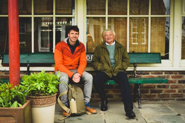 Walking Britain's Lost Railways presenter Rob Bell and Tom Pyemont at the former Hassendean station, now Tom's home.