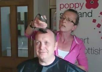 Fiona Deacon cuts husband David's hair in less than 2.6 minutes.