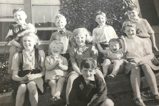 One of Ian's happiest early memories as children of Douglas Road in Melrose celebrate VE Day on May 8, 1945. They are, back row from left: Graham Lawrie,Jim Purves, David Lawrie and John Hart. Front row from left: Elizabeth Purves, Ian Hewat, Sally Hewat ,Ronnie Inglis and Sheila Inglis. Seated on ground: Duncan Lawrie.