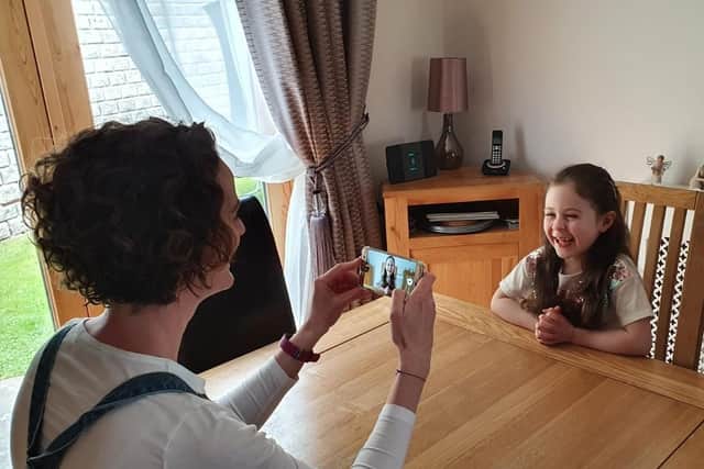 Earlston parent council chairperson Sally Tait records her P1 daughter Sophie’s clip for the video.