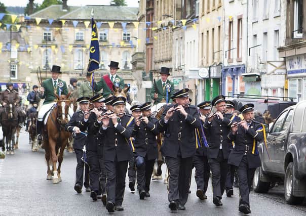 Hawick Cornet Connor Brunton follows behind the Drums and Fifes band in 2019.