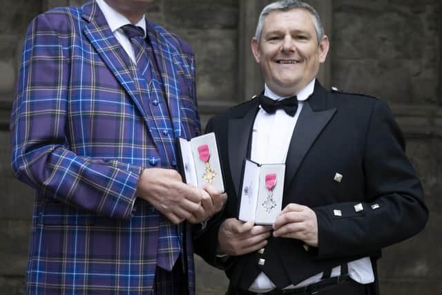 John Davidson, pictured right, receiving his MBE at Holyrood House last year, alongside rugby legend and MND campaigner Doddie Weir, who was picking up his OBE.