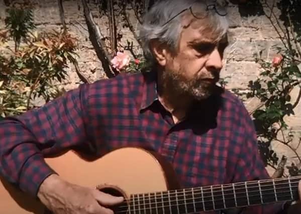 Andy Smith, chairman of Kelso Folk and Live Music Club performs an acoustic instrumental version of Sting's Fields of Gold on the video.