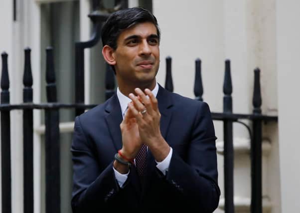 UK Government chancellor of the exchequer Rishi Sunak taking part in a nationwide clap for carers last month in London. (Photo by Tolga Akmen/AFP via Getty Images)