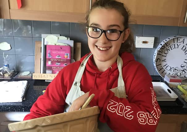 Hannah Cargill, 12, who has raised cash for the children's ward at the Borders General Hospital by baking up a storm in her kitchen.