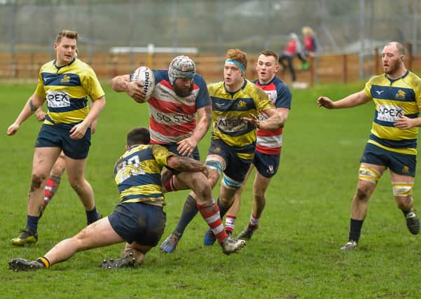 Peebles, in red and white, in action last season with a 52-12 win over Gordonians (archive picture by Stephen Mathison)