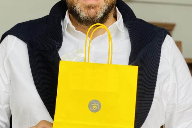 Luigi Caterion, owner of the Italian Job Barbers in Galashiels and Kelso, with the free bag which will be given to every customer when the shops reopen on July 15.