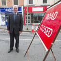 Councillor Watson McAteer at roadworks next to O'Connell Street in Hawick.