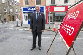 Councillor Watson McAteer at roadworks next to O'Connell Street in Hawick.