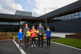 Jedburgh Grammar Campus headteacher Susan Oliver and pupils taking delivery of the keys to the £32m building in March, unaware at the time that they wouldn't get to use them for a further five months.