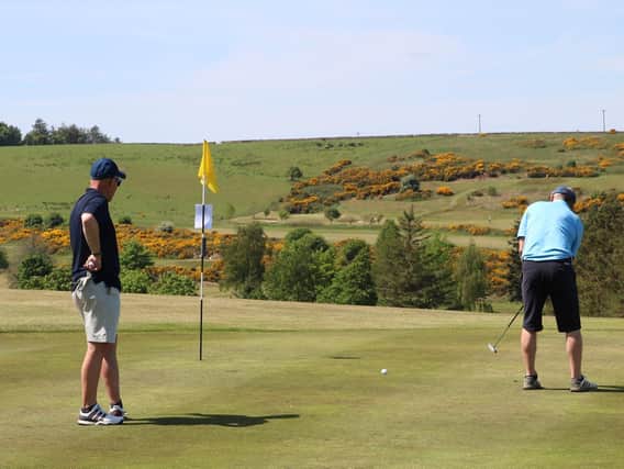 Golfers Donald Miller and Brian Cockburn putting  druing a round earlier this month at Jedburgh Golf Club