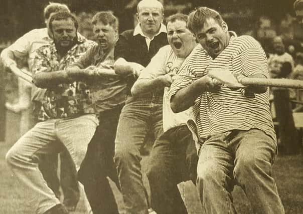 Competitors put their backs into it during the tug o' war event at Earlston's Civic Week Saturday on July 13, 1995.